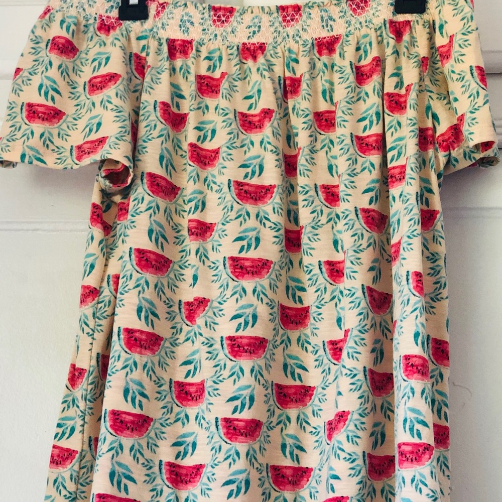 watermelon shirt, shows shoulders